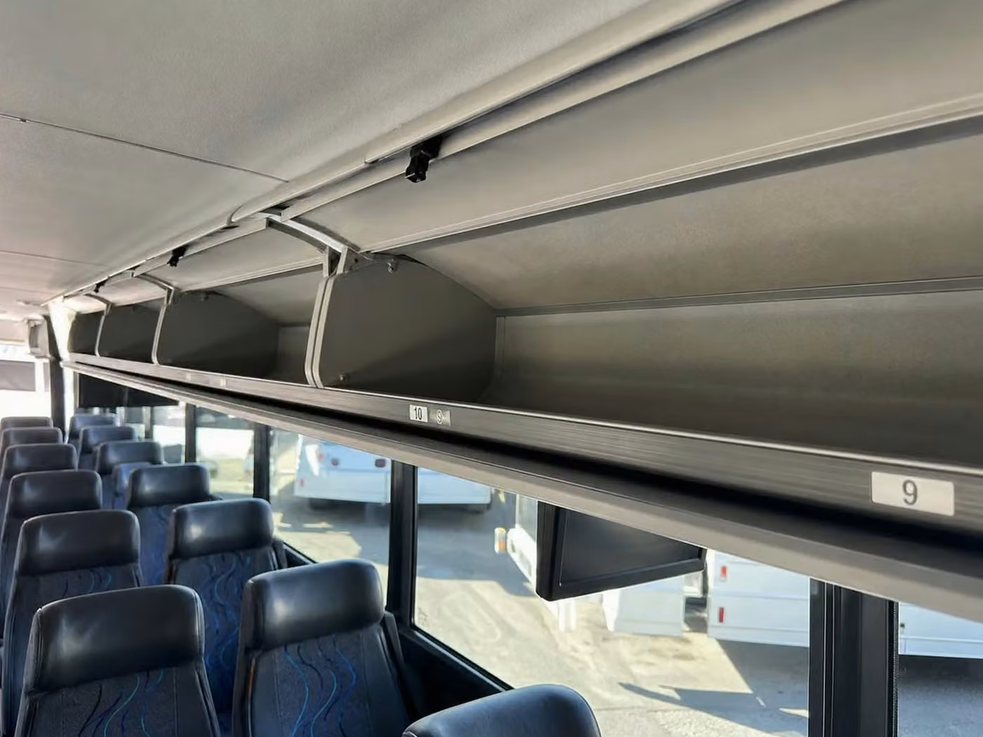 monterey 35 passenger minibus overhead storage