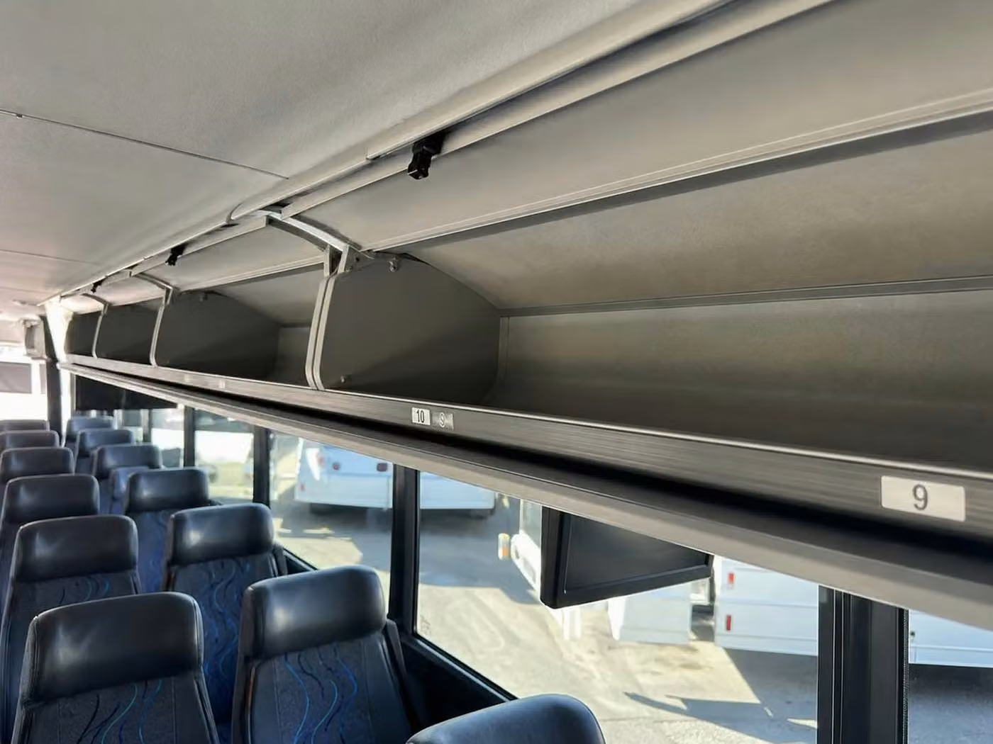monterey 56 passenger charter bus overhead storage